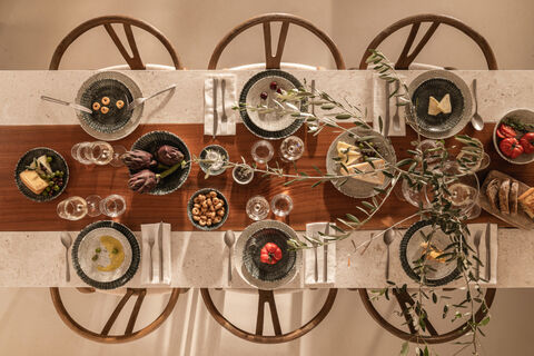 Table set with Thomas Sandora items seen from above