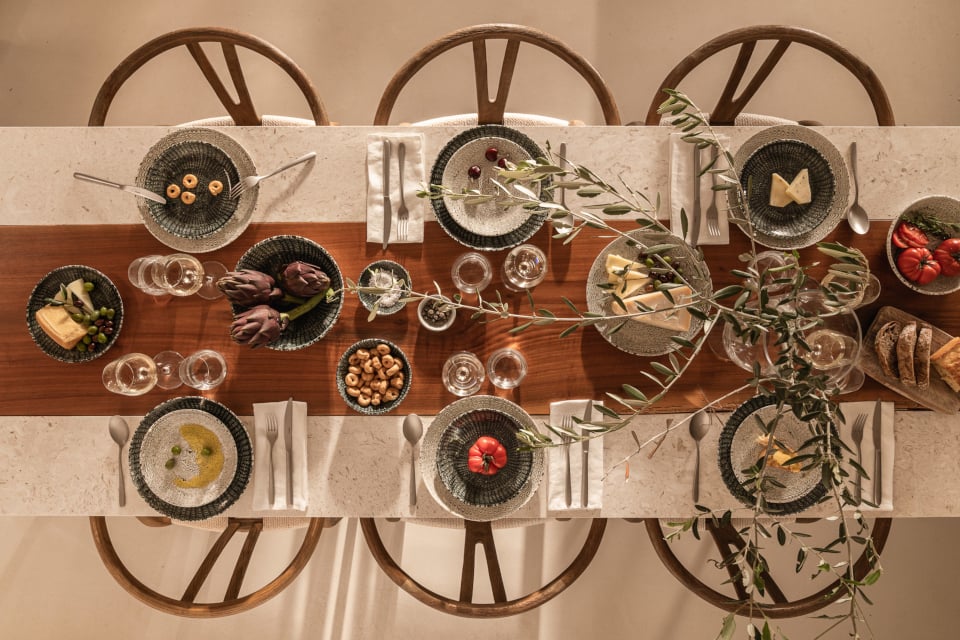 Table set with Thomas Sandora items seen from above