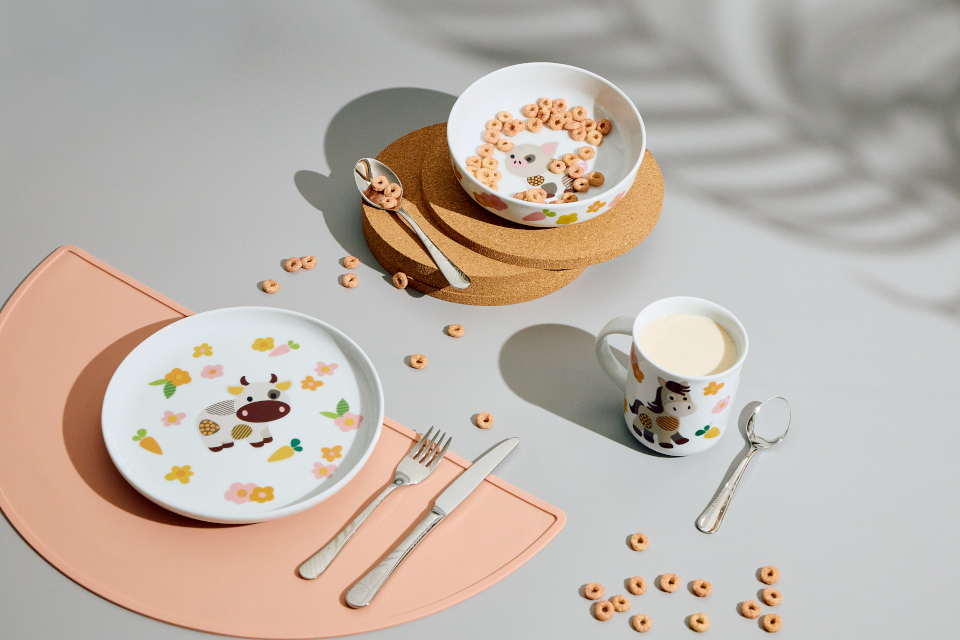 Plate, bowl and mug from Thomas Kids collection and cutlery on grey background