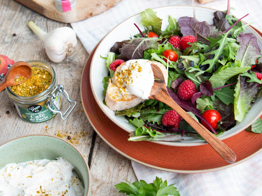 Fresh salad with raspberry dressing served in Thomas bowl